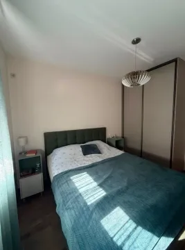 Furnished bedroom with a double bed, nightstands, and a wardrobe. - image 8