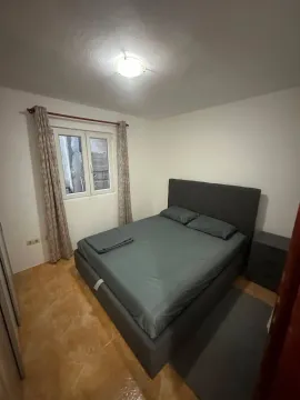 Small bedroom with a double bed and a window. - image 6