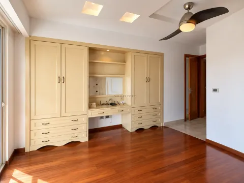 Bedroom with built-in wardrobes and a desk. - image 9
