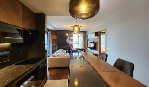 View from the kitchen with a breakfast bar towards the living room. - image 16