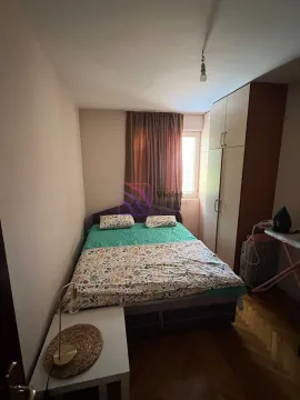 Bedroom with a double bed, wardrobe, and window. - image 6