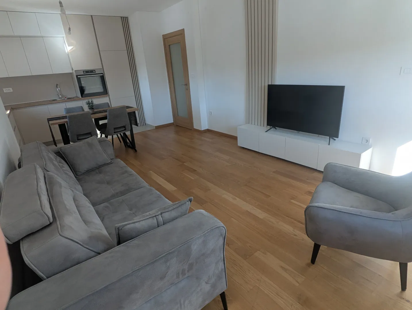 Spacious living room connected to the dining area and kitchen.