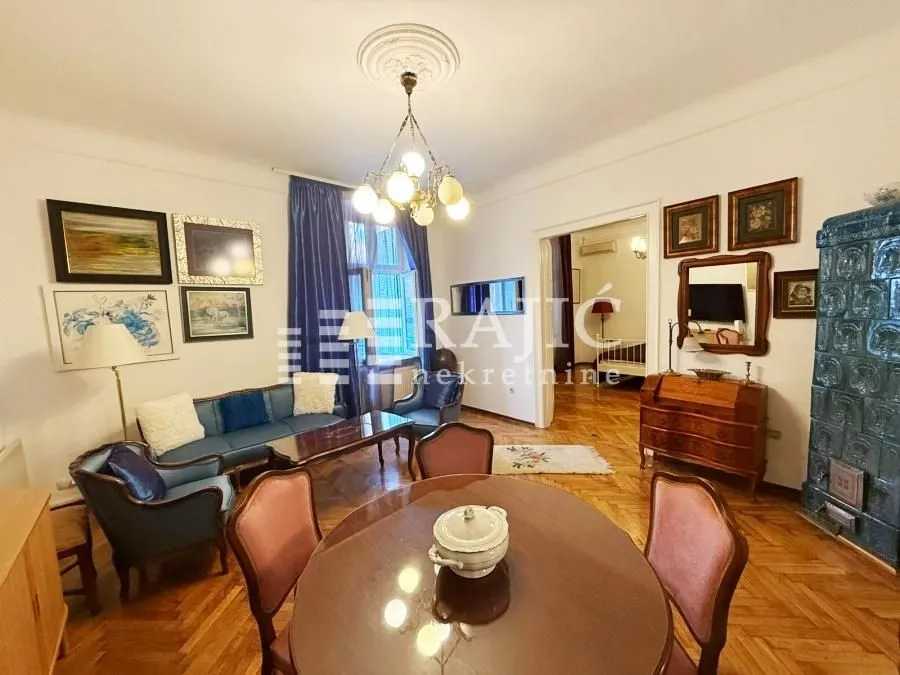 Spacious living room with a dining area and classic furniture.