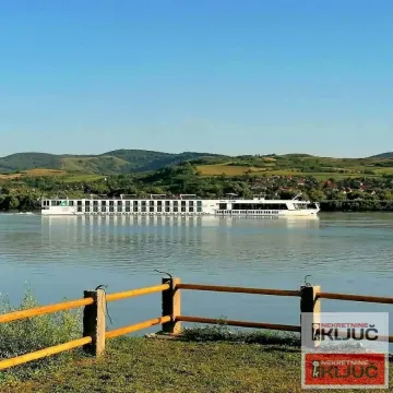 View of the river and a ship from the landscaped riverbank. - image 3