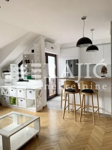 Living room with dining area and kitchen.