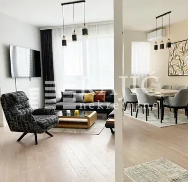 Modern living room with a sofa set and dining area. - image 3