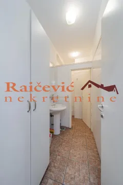 View of the bathroom with a washbasin and tiles. - image 17