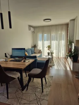 Bright living room with dining area and terrace access. - image 4
