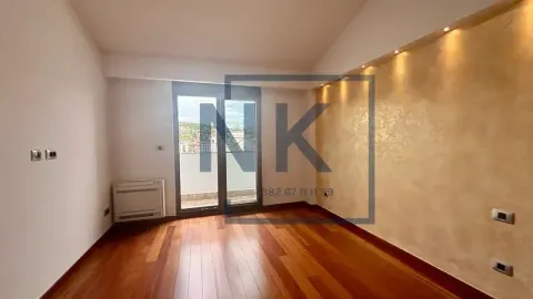 Empty living room with hardwood flooring and balcony access. - image 9