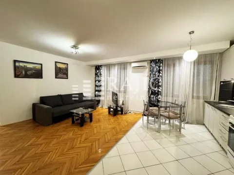 Living room connected to the dining area and kitchen. - image 3