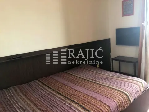Furnished bedroom with a double bed. - image 6