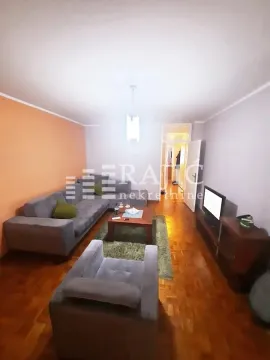 Living room with sofa set and parquet flooring. - image 3