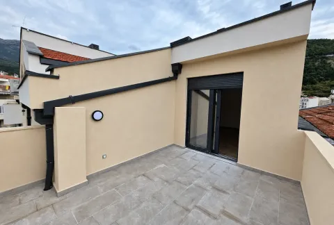 Spacious rooftop terrace with tiled flooring and access to the interior space. - image 12