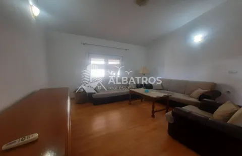 Living room with a sofa set and wooden flooring. - image 2
