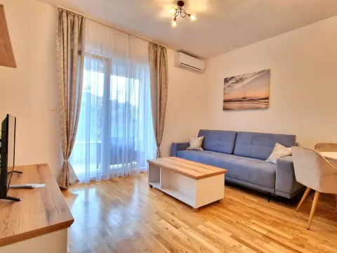 Living room with a sofa, coffee table, and access to the terrace. - image 2