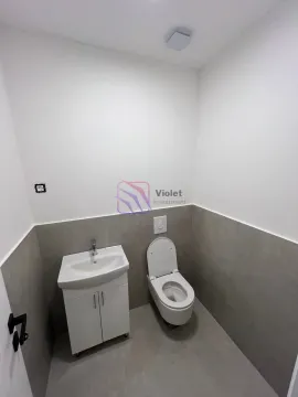 Smaller bathroom equipped with a washbasin and toilet. - image 6