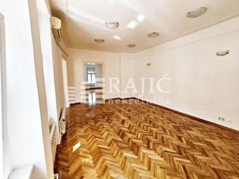 Empty spacious room with parquet flooring and white walls. - image 10