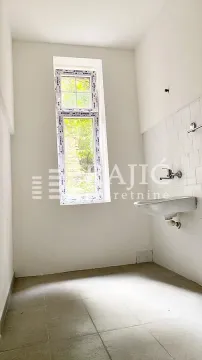 Empty bathroom with a sink and a window. - image 6