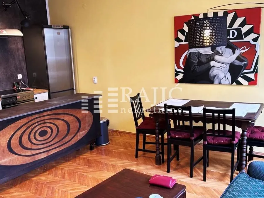 Living room with dining area and kitchen.