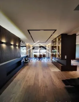 Spacious living room with modern wood wall paneling and hardwood flooring. - image 17
