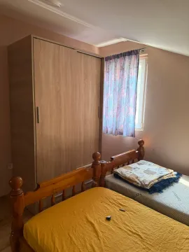 Bedroom with wooden beds and a wardrobe. - image 16