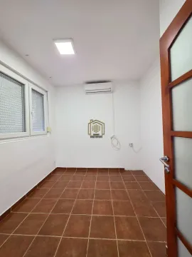 Empty bright room with ceramic floor tiles and an air conditioning unit. - image 13