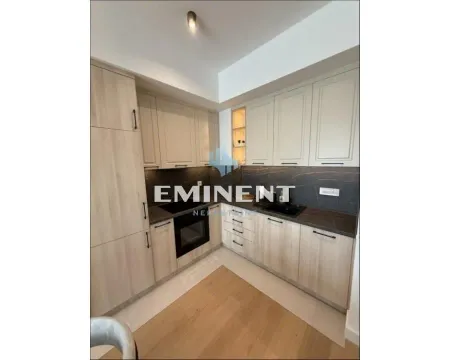 Modern kitchen with built-in appliances and wooden cabinetry. - image 4