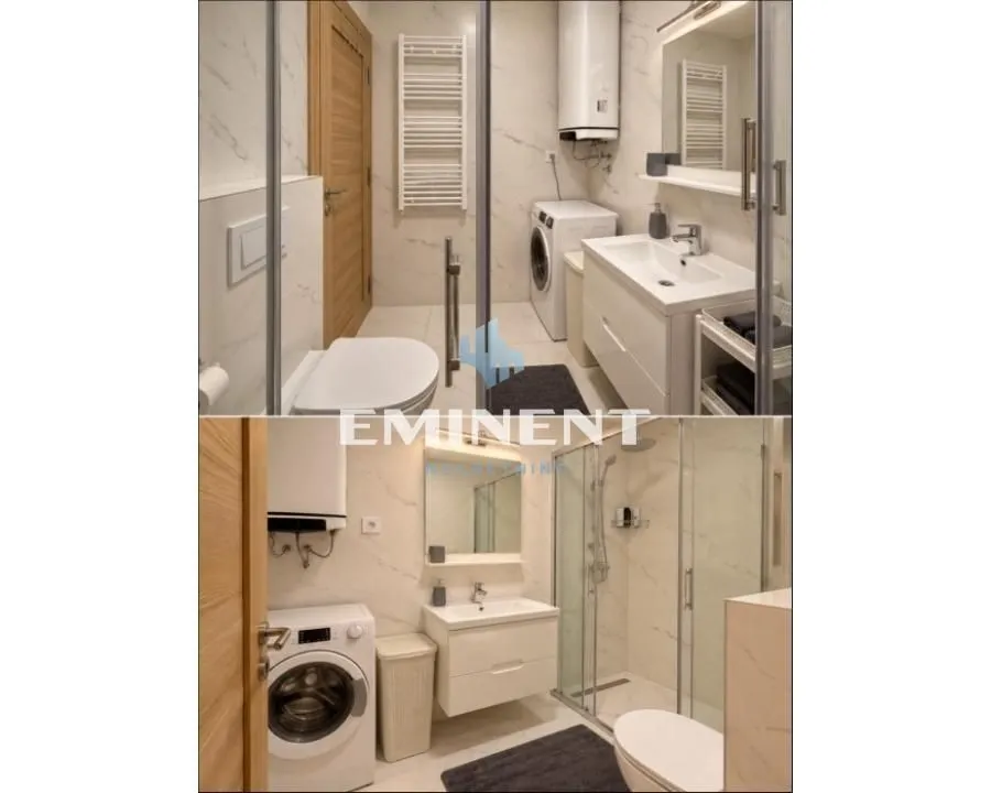 A well-lit modern bathroom with a walk-in shower, washbasin, and washing machine.