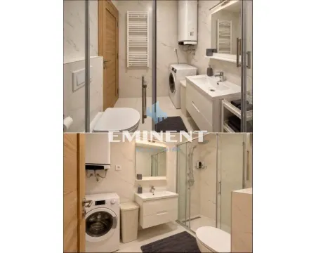 A well-lit modern bathroom with a walk-in shower, washbasin, and washing machine. - image 7