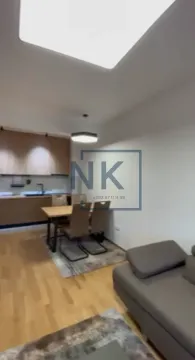 Living room with dining area and kitchen in the background. - image 2