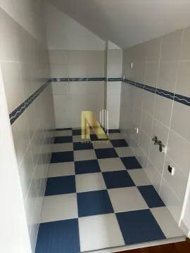 Empty bathroom with tiles and a sloping ceiling. - image 6