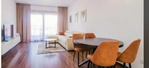 Living room with a dining area and seating set. - image 4