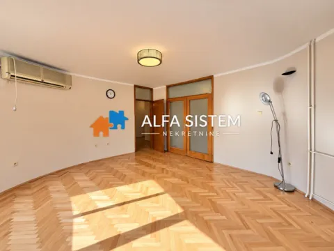 Empty living room with parquet flooring and an air conditioner. - image 23