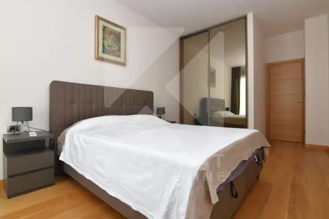 Furnished bedroom with a double bed, wardrobe, and wooden flooring. - image 6