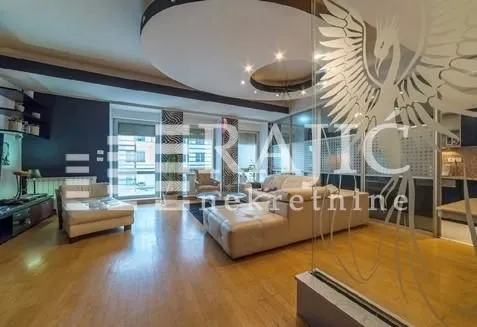 Spacious living room with seating furniture and modern ceiling. - image 6