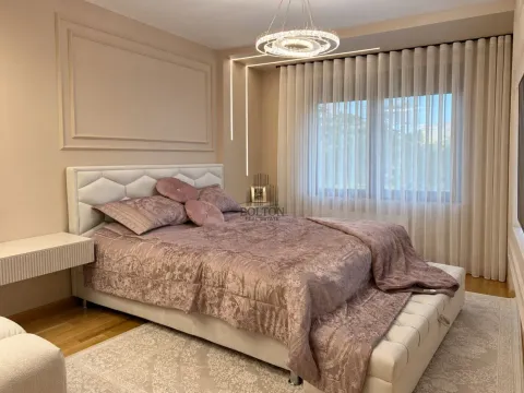 Modern bedroom with a double bed and elegant lighting. - image 9
