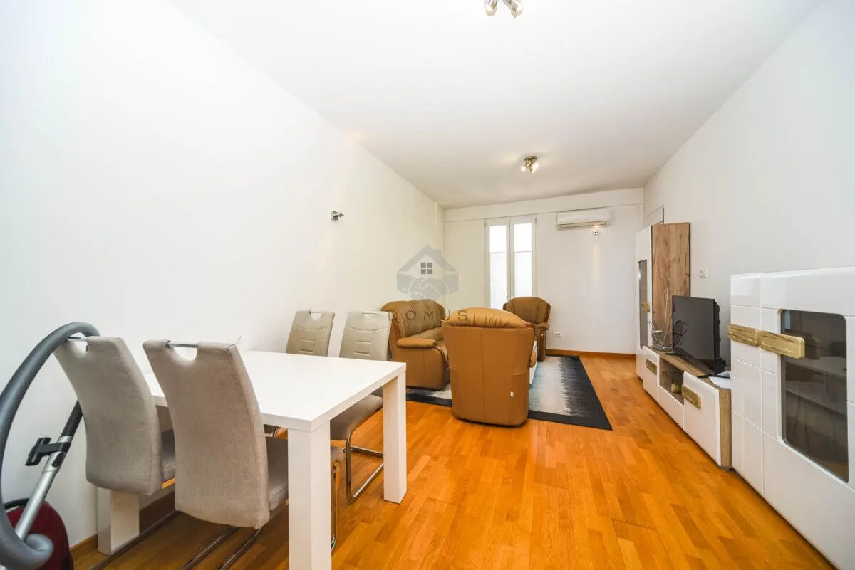 Living room with a dining table and seating set.