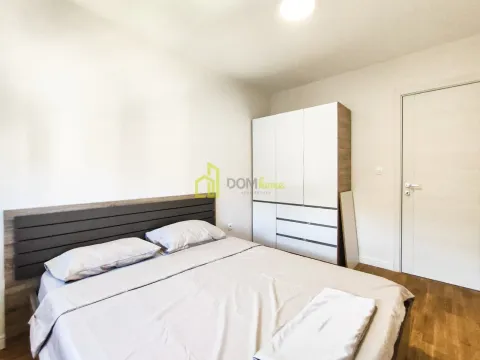 Bedroom with a double bed and a wardrobe. - image 6