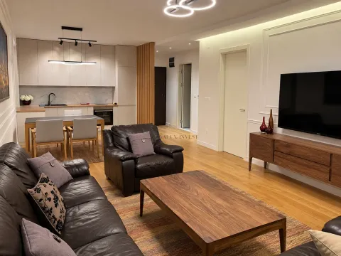 Spacious living room with sofa set, dining area, and open kitchen. - image 3