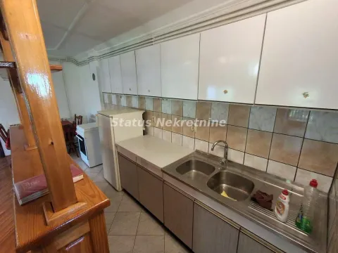 Smaller kitchen with a sink, base units, and wall cabinets. - image 7