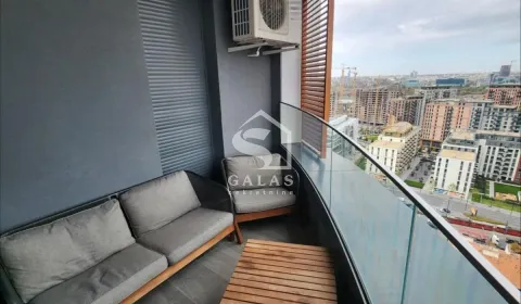 Furnished balcony with seating set and city view. - image 12