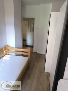 Smaller bedroom with a bed and wardrobe. - image 10