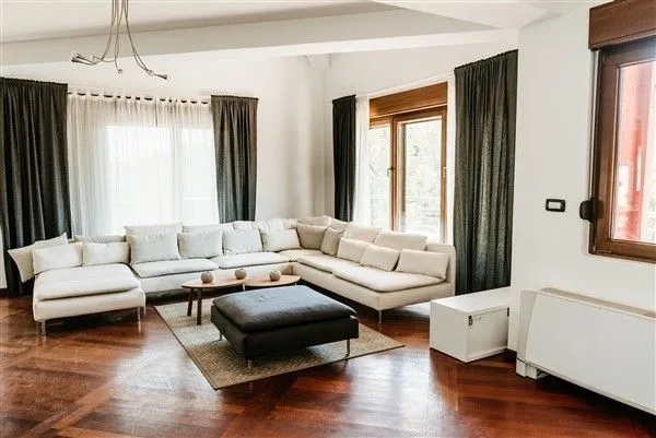 Bright living room with a large sectional sofa.