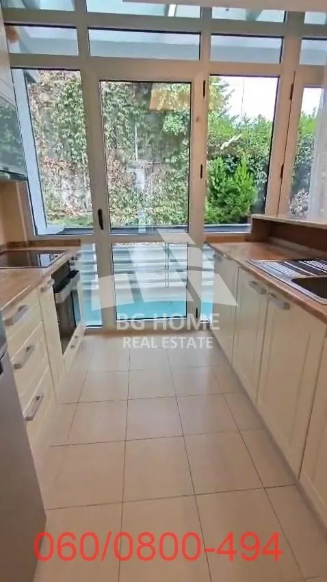 Kitchen with cabinetry and access to the terrace.