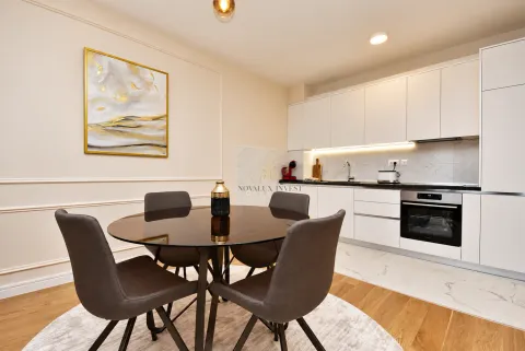 Modern kitchen with a dining table and chairs. - image 5