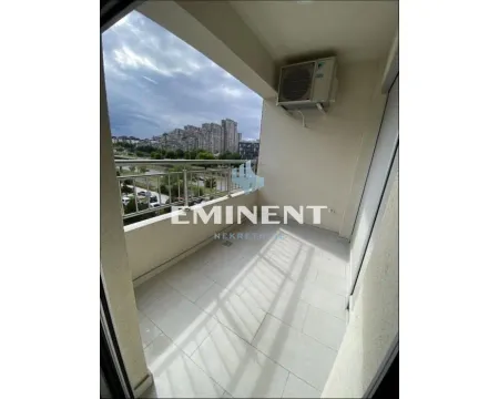 Covered balcony with a view of the city and surroundings. - image 9