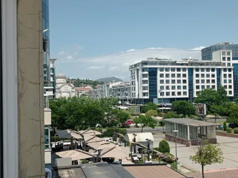 Pogled sa prozora na gradski trg i okolne zgrade u Podgorici. - image 11