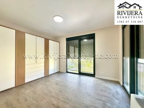 Empty bedroom with a large built-in wardrobe and access to the terrace. - image 7