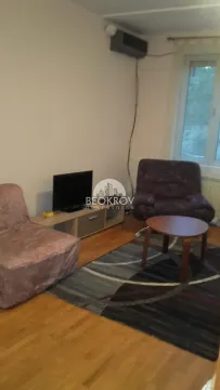 Small living room with armchairs, a television, and a coffee table. - image 2