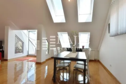 Spacious living room with dining area and skylights. - image 4